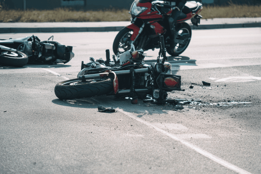 Tampa motorcycle accident attorney discussing helmet law claim with injured rider in office consultation